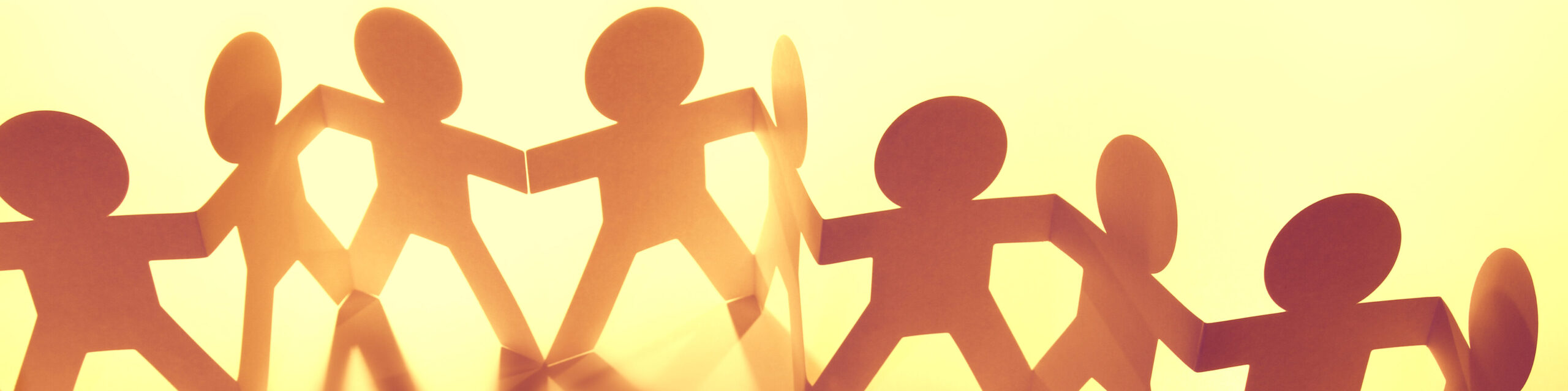 Team,Of,Paper,Doll,People,Holding,Hands